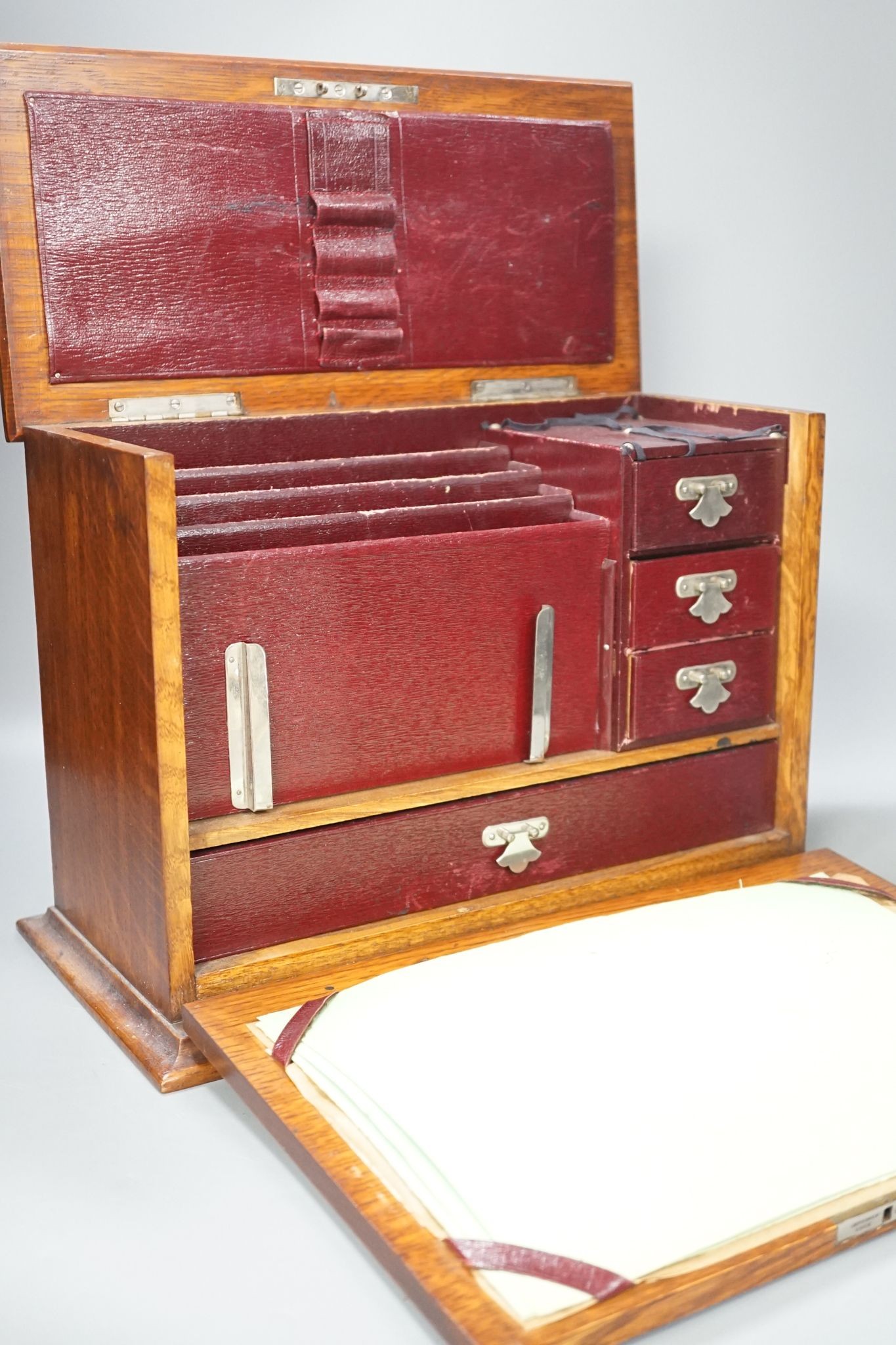 An Edwardian Morocco leather lined oak stationery box and letter rack 36cm